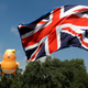 Demonstrators float a blimp portraying U.S. President Donald Trump, next to a Union Flag above Parliament Square, during the visit by Trump and First Lady Melania Trump in London